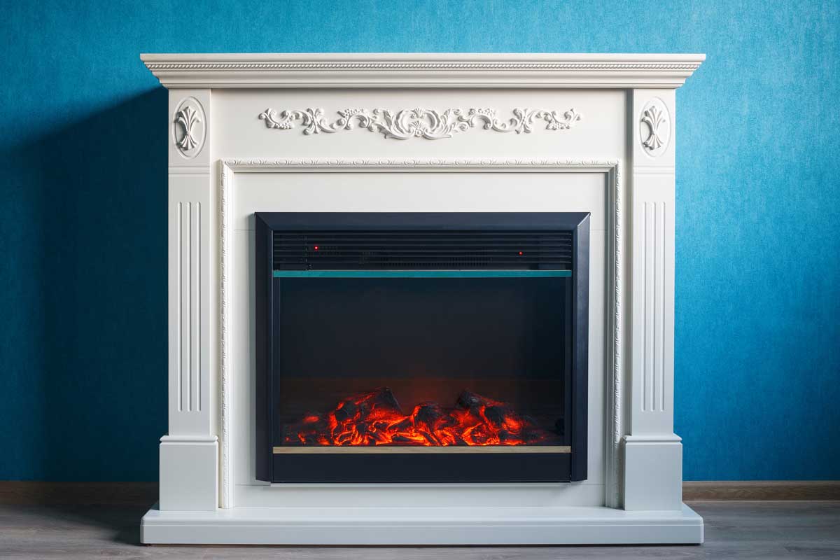 Black electric fireplace with decoration photographed in the interior, Does An Electric Fireplace Need A Vent?