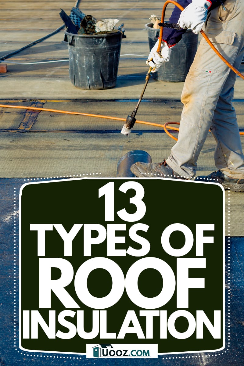 A roof installer using a blowtorch to melt a bitumen felt roofing on a roof, 13 Types Of Roof Insulation