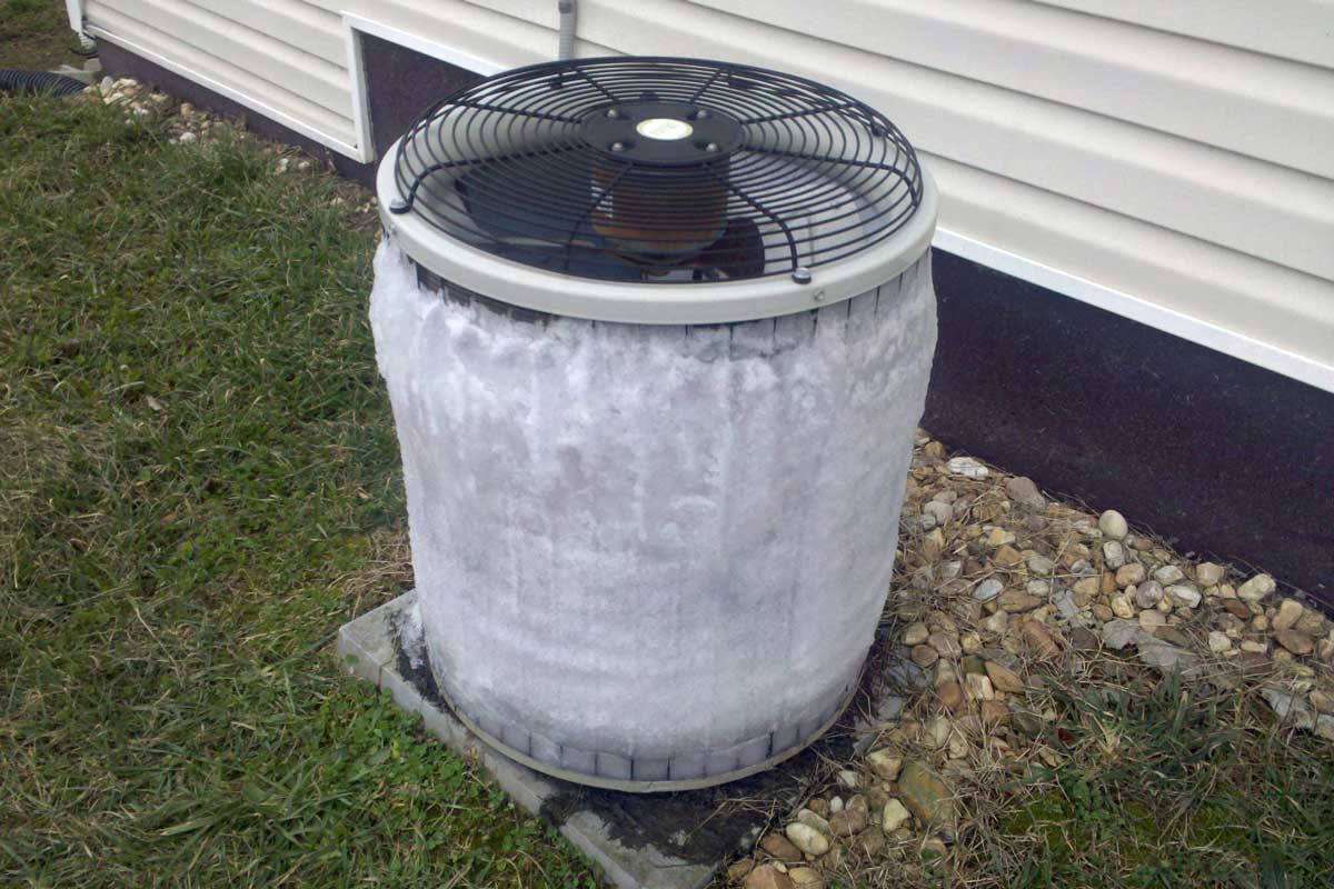 frozen air conditioning unit outside of the house