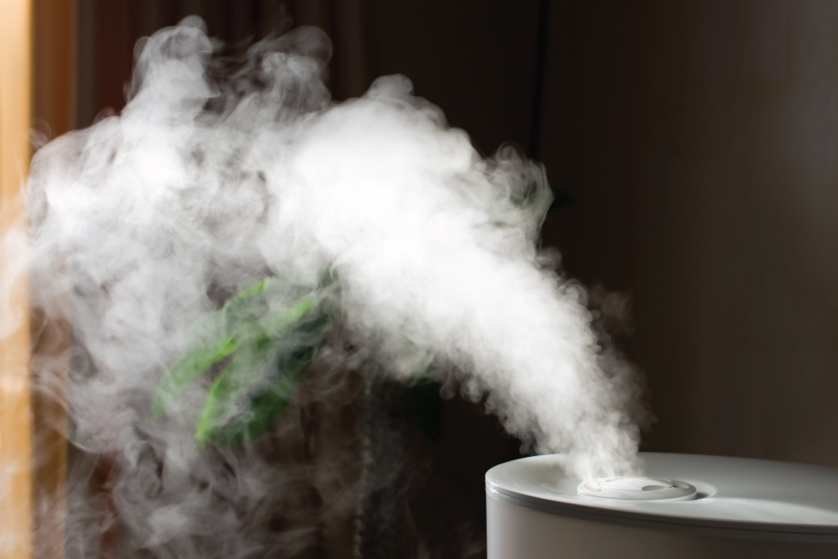 small white humidifier blowing steam, How Much Does It Cost To Add A Humidifier To Your Furnace