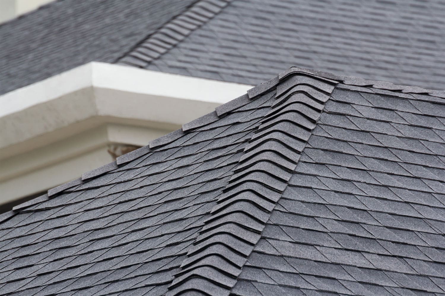 A detailed photo of an asphalt roofing of a mansion
