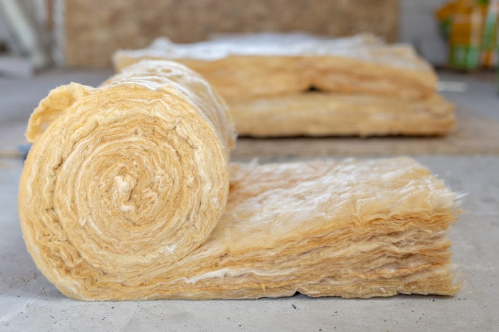 An up close photo of mineral rockwool insulation placed on the attic of a house