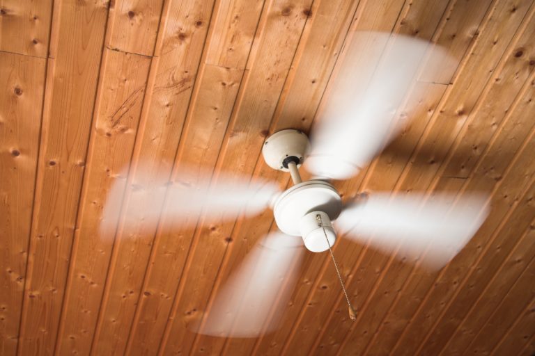 wooden ceiling fan, white fans spinning quickly, why is the ceiling fan clicking [and how to solve that]