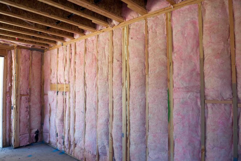Wall with pink fiberglass insulation, 9 Types Of Thermal Insulation You Should Know