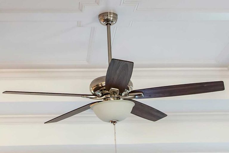 White tray ceiling fan in small new construction house, Are Ceiling Fans Supposed To Wobble? (And How To Fix That)