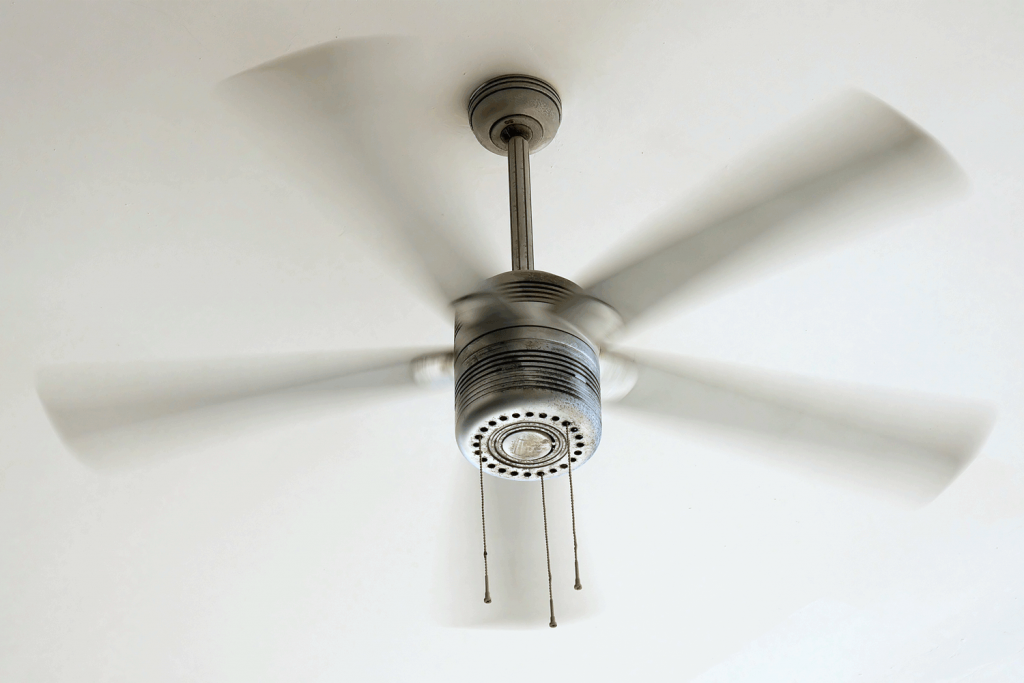 A ceiling fan spinning fast