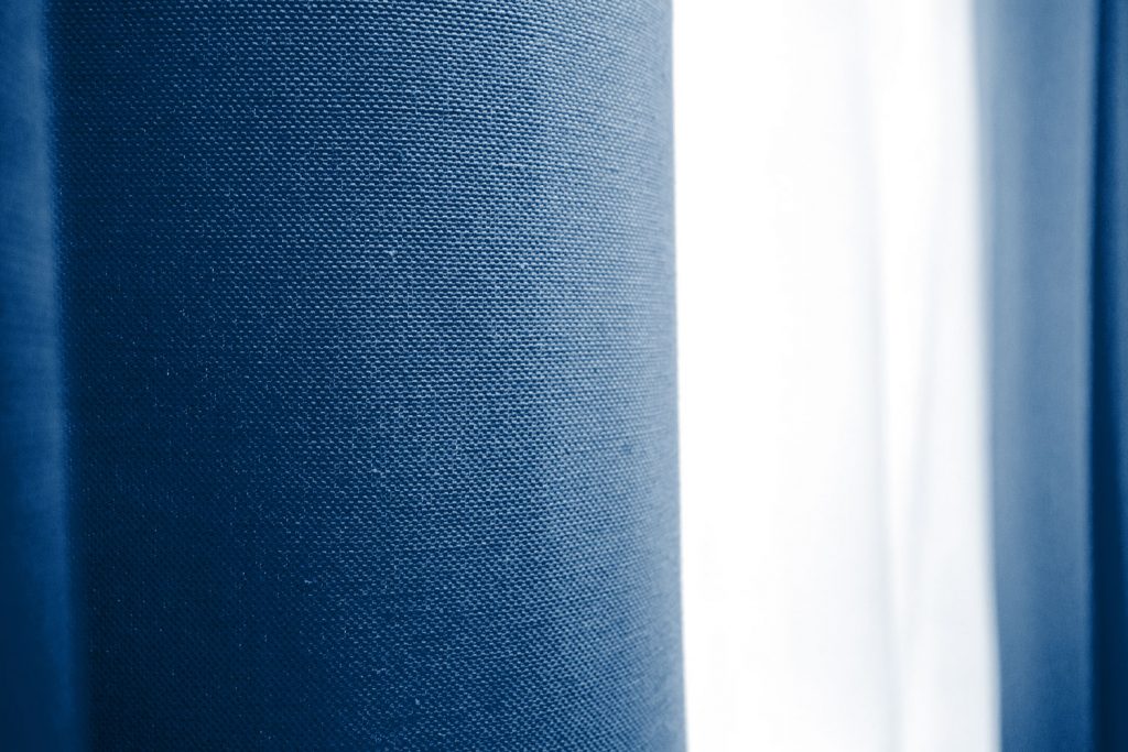 Blue blackout curtains inside a living room
