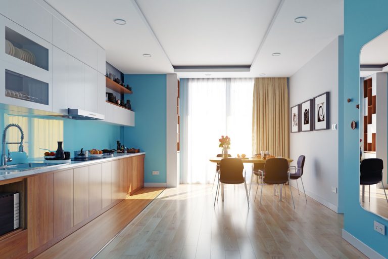 Interior of an ultra modern apartment living room with blue painted walls, wooden flooring, and a gorgeous wooden paneled cabinetry, Do Blackout Curtains Block Heat?