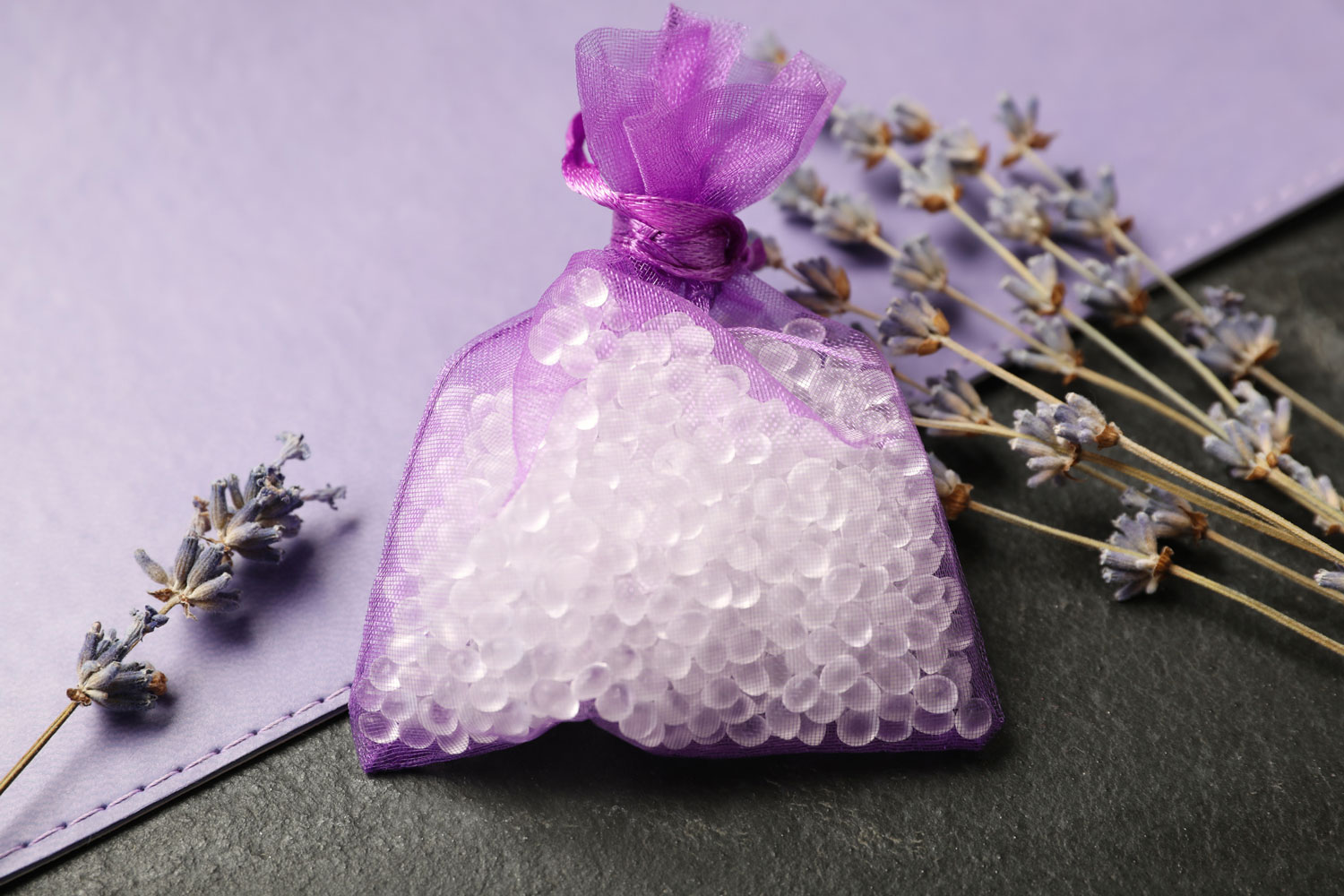 Silica gel and dried lavender on black table,How To Naturally Reduce Humidity In A Room