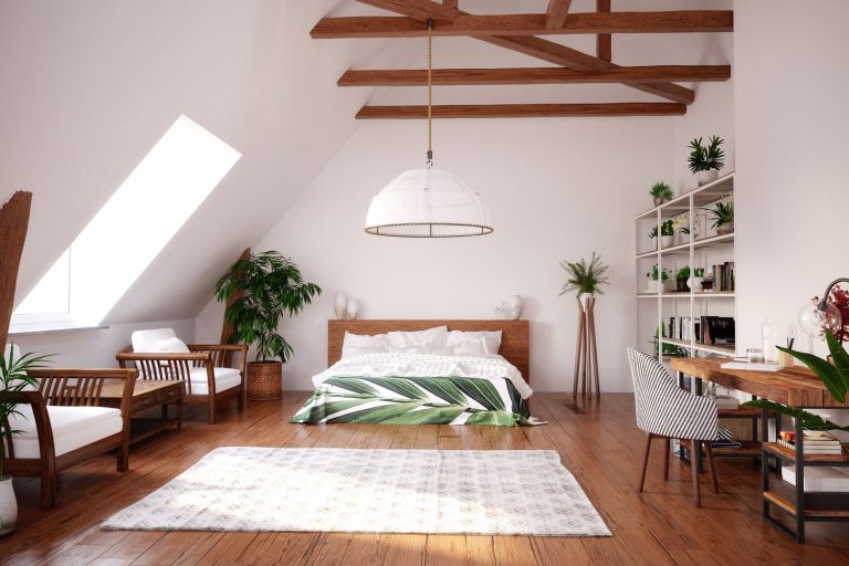 A rustic inspired attic bedroom with wooden flooring, white painted walls, and indoor plants spread all over the room, Does An Attic Fan Help With Humidity?