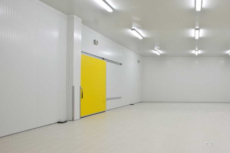 Little gray empty room with plastic trim of the walls and yellow door, How To Improve Air Circulation In A Room Without Windows