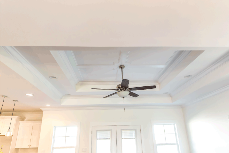 ceiling fan spinning while installed on a vaulted white ceiling. Can You Put A Ceiling Fan On A Vaulted Ceiling