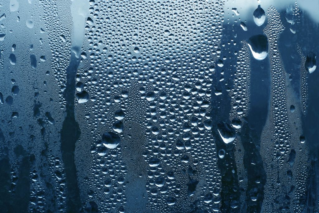 Detailed photo of moist on the window of a house
