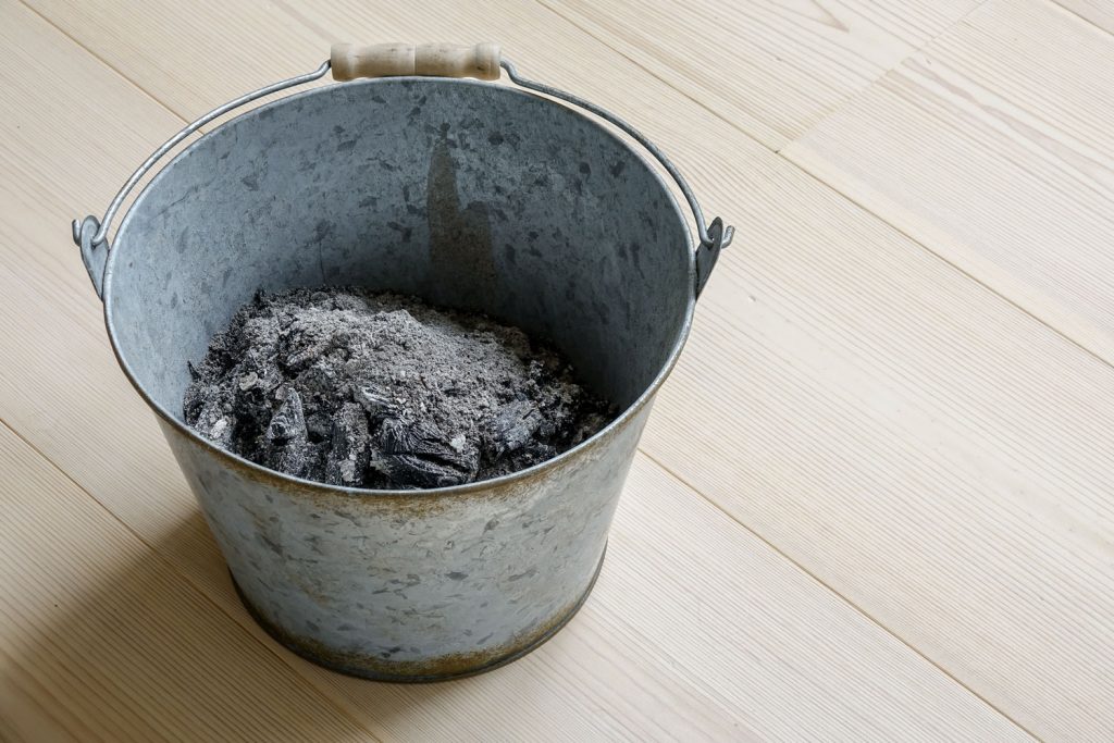 Wood ash collected in a small bucket