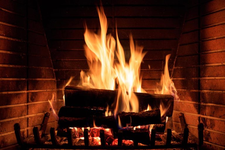 Burning wood on a fireplace, How Often Should You Add Wood To A Fire In Fireplace?