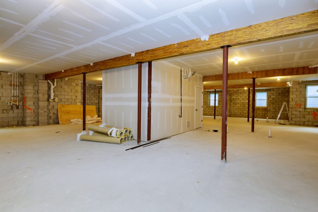 A basement under construction along with other construction materials on the floor