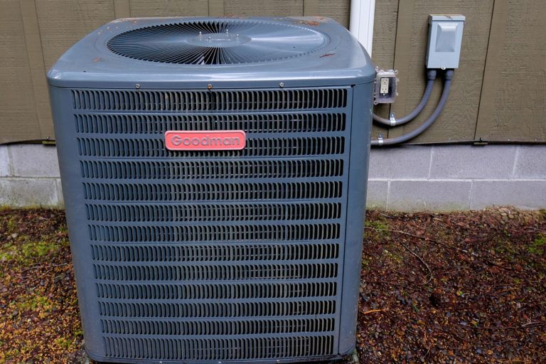 A black colored Goodman central air conditioning unit, How To Clean A Goodman Central Air Conditioner