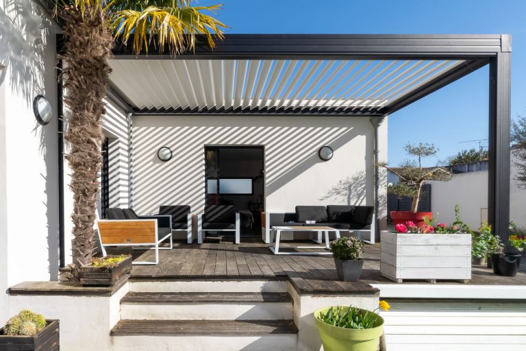 A luxurious modern patio with aluminum roofing, How To Insulate An Aluminum Patio Roof [A Complete Guide]
