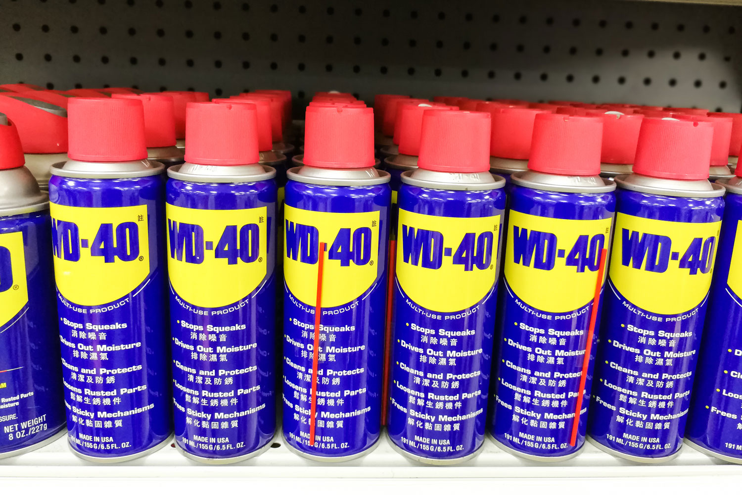 A store shelf filled with WD-40 products