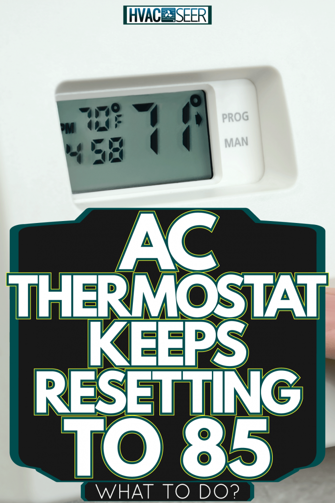 A man adjusting the thermostat, AC Thermostat Keeps Resetting To 85—What To Do?