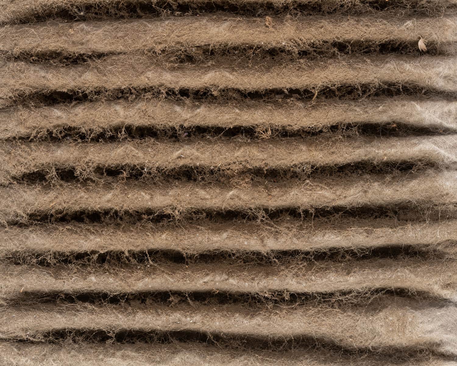 Close up of HVAC home air filter showing the dirt and particle cause bacteria inflection and sickness.