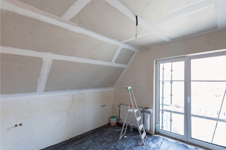 Empty-bedroom-interior-with-gypsum-board-ceiling-at-renovation.-Does-Drywall-Add-R-Value-And-Help-Insulate