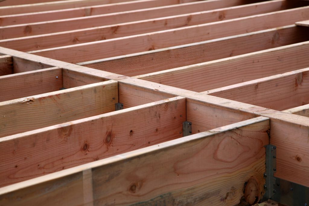 Floor beam under construction with visible plates for nails