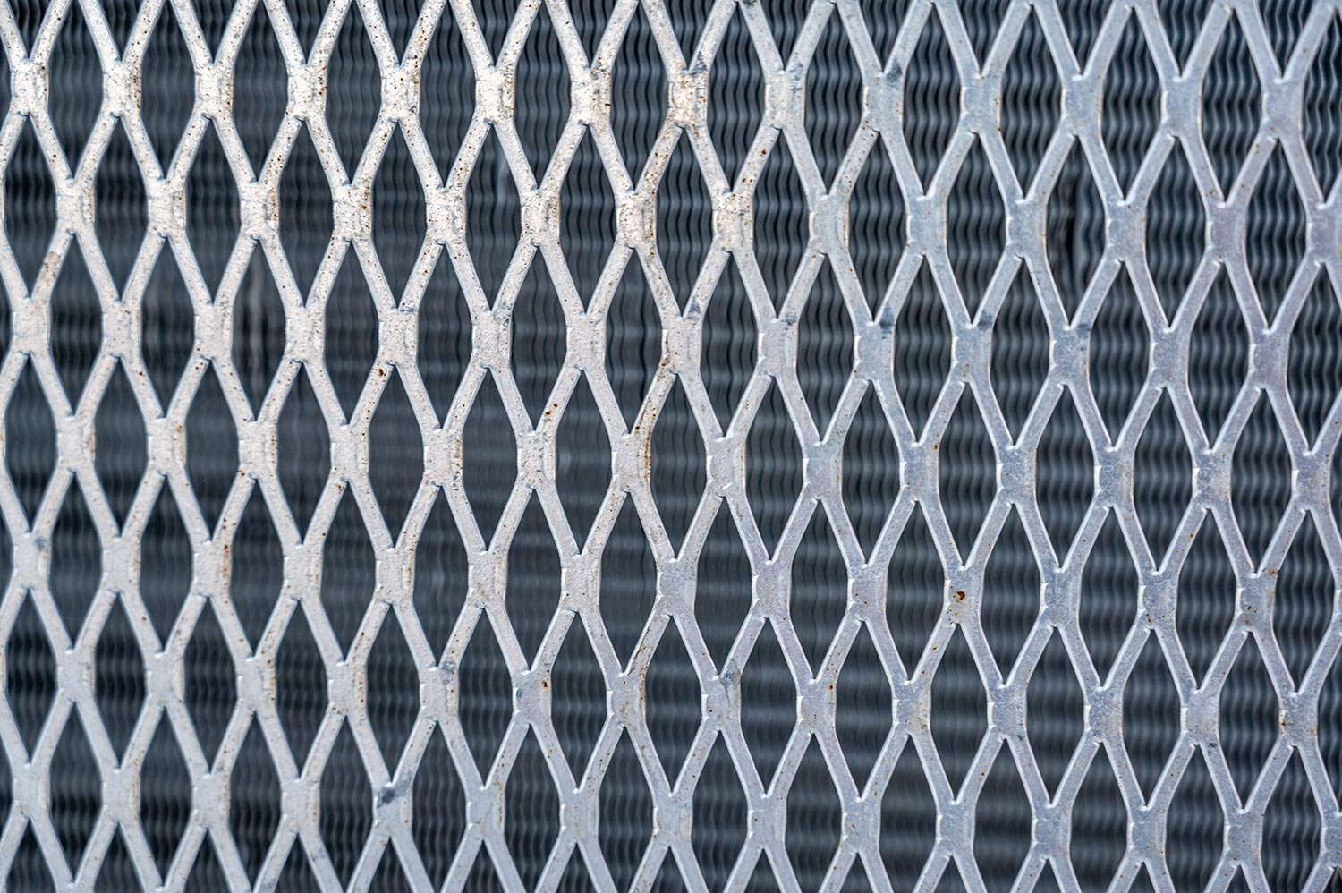Metal screen and heat exchanging fins of a air conditioner