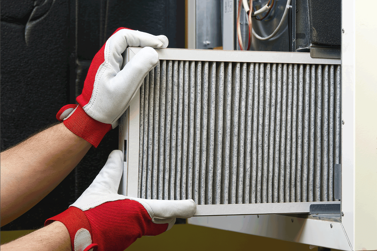 Replacing Dirty Air filter for home central air conditioning system. Change filter in rotary heat exchanger recuperator