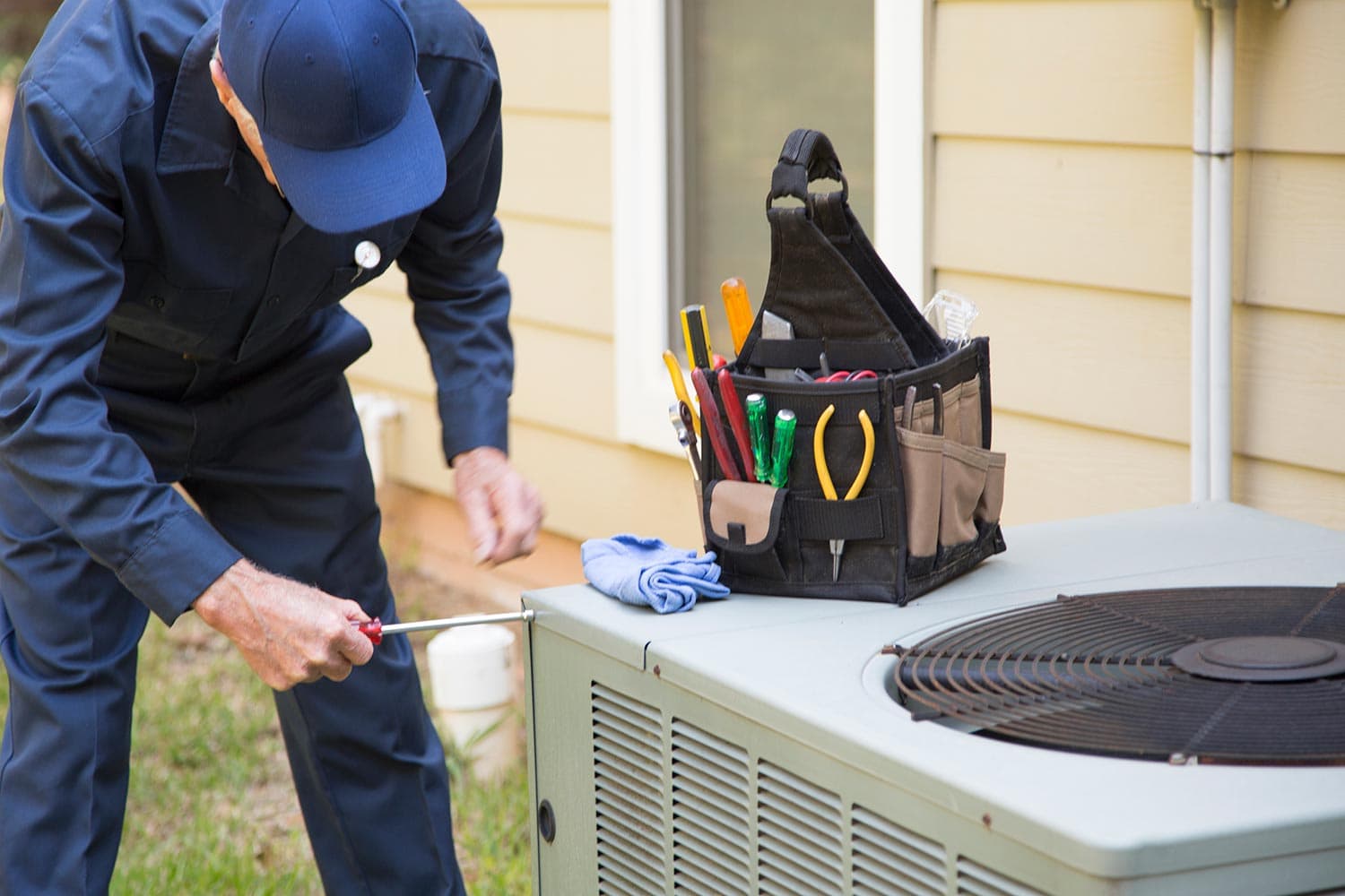 Technician services outside AC units and generator