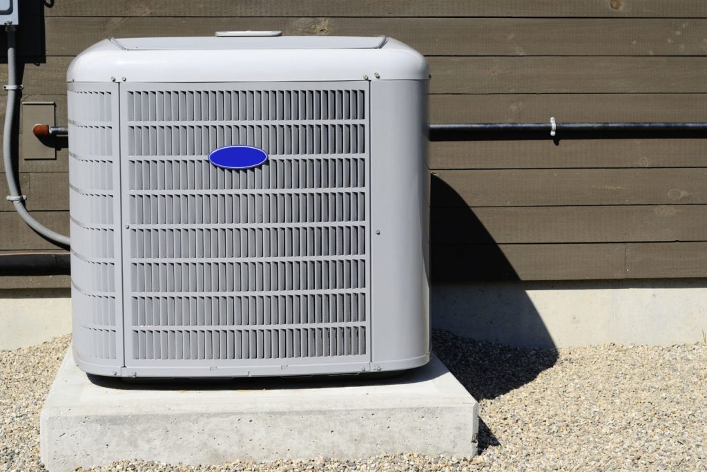 A central air conditioning condenser unit photographed outside