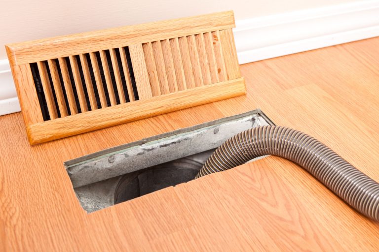 A floor furnace cover removed to clean the floor furnace, How To Remove A Floor Furnace