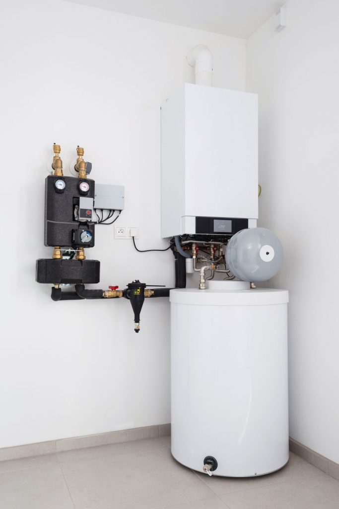 A heating system with a boiler on the top placed under the basement
