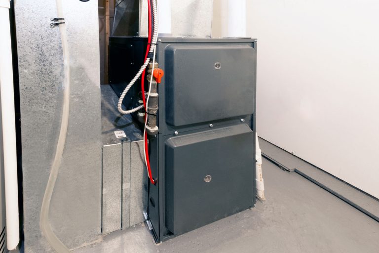 A home high energy efficient furnace in a basement, How To Hide The Furnace In Your Basement [Inc. Unfinished One]