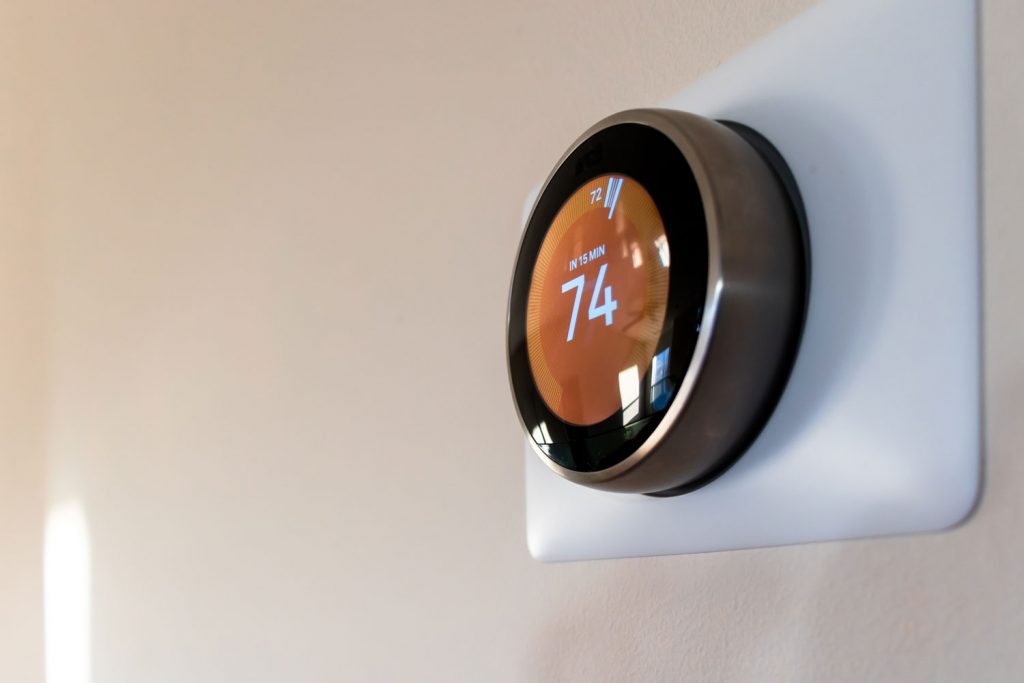A thermostat set at 74 degrees to avoid dry air
