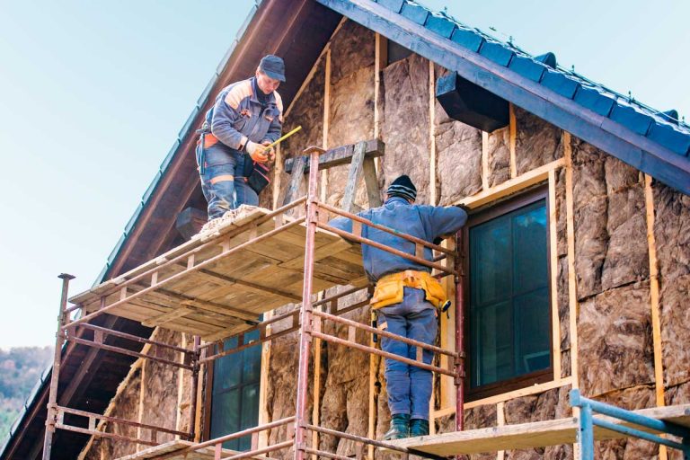 Construction workers insulating house, How Much Does It Cost To Insulate A 3,000 Sq Ft House?