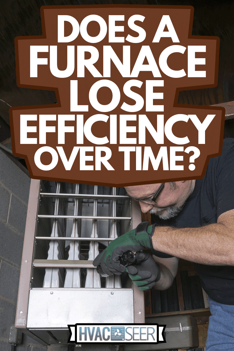 Technician Checking Out A Overhead Gas Furnace, Does A Furnace Lose Efficiency Over Time?