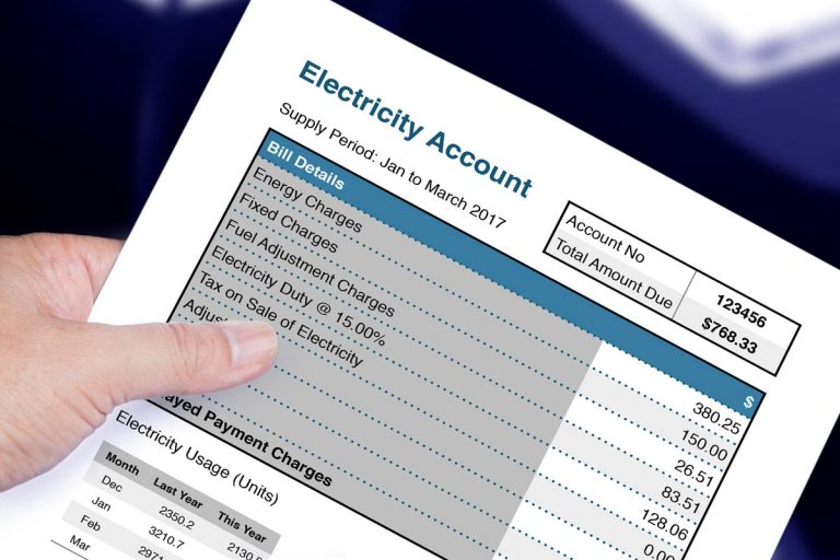 Hand holding electric bill account, How Much Does It Cost To Run An Electric Furnace?