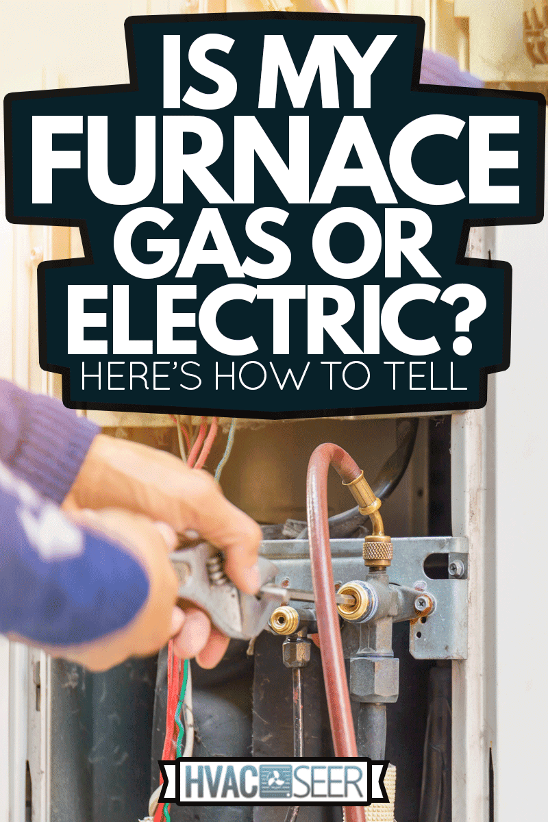 Selective focus of furnace Repair, repairman on the floor fixing furnace system, Is My Furnace Gas Or Electric? Here's How To Tell