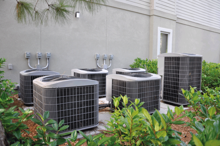 Several-outdoor-large-central-air-heat-pump-units.-Should-You-Clean-Snow-Off-Your-Heat-Pump