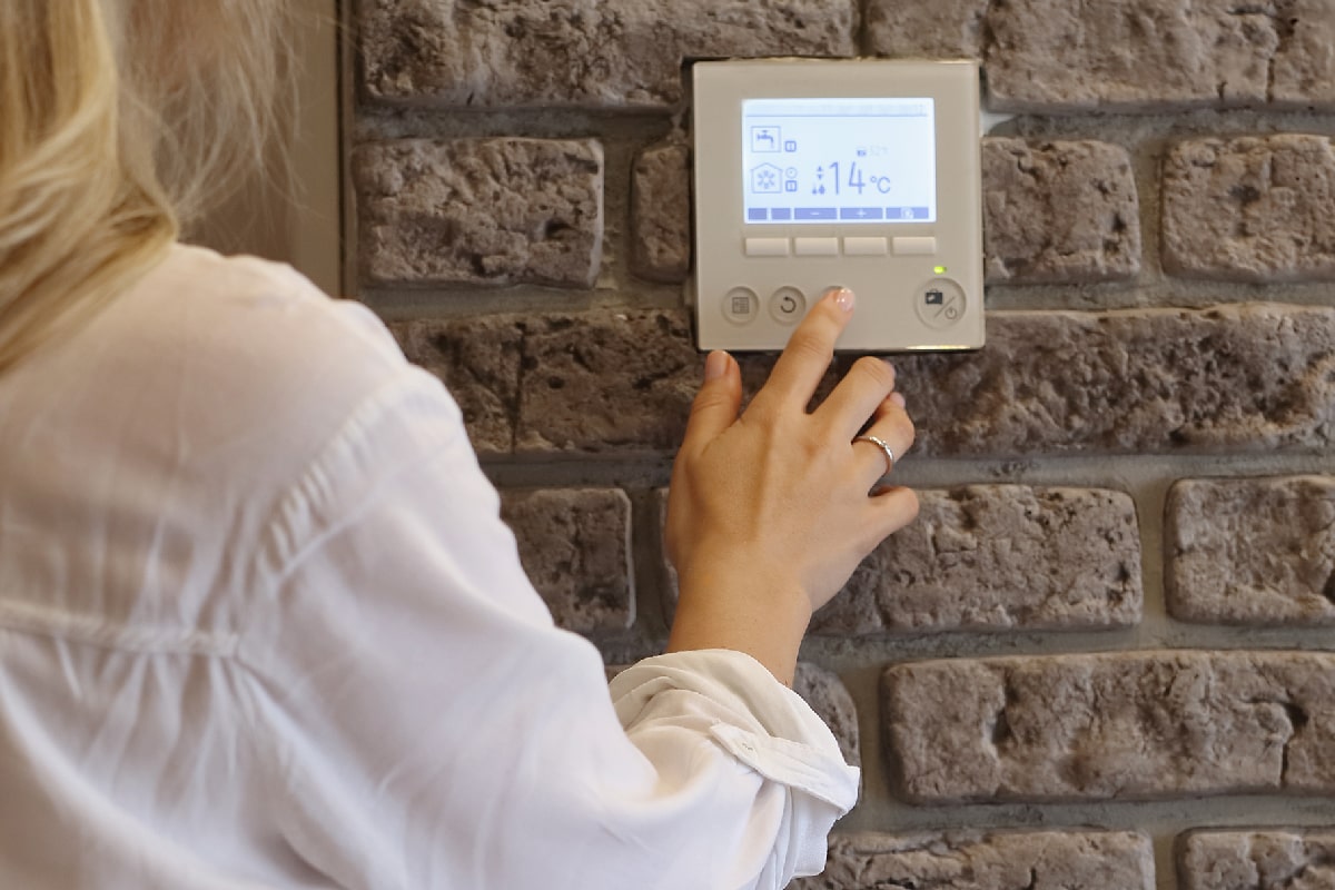 Woman reset the thermostat