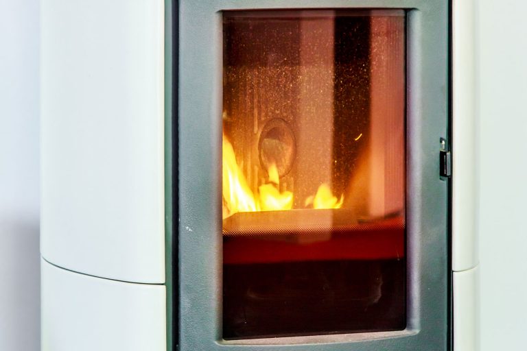 closeup on the combustion of an pellet stove, Pellet Stove Glass Gets Black—What To Do?