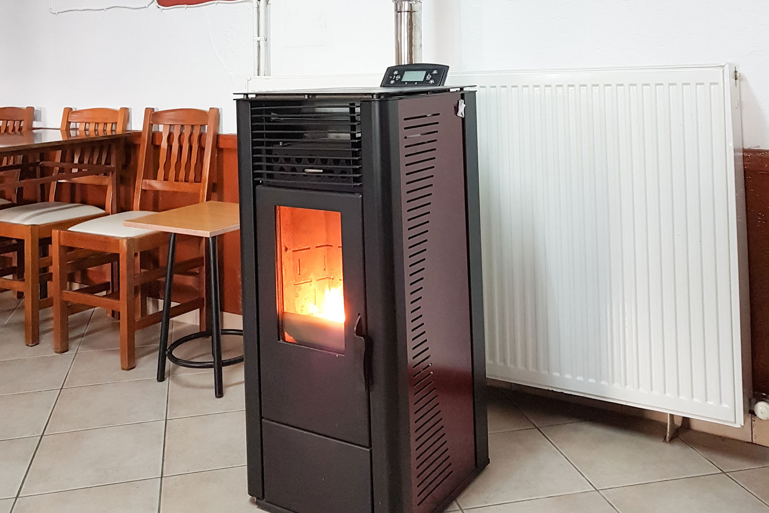 Pellet heater flames hot in winter day in a room