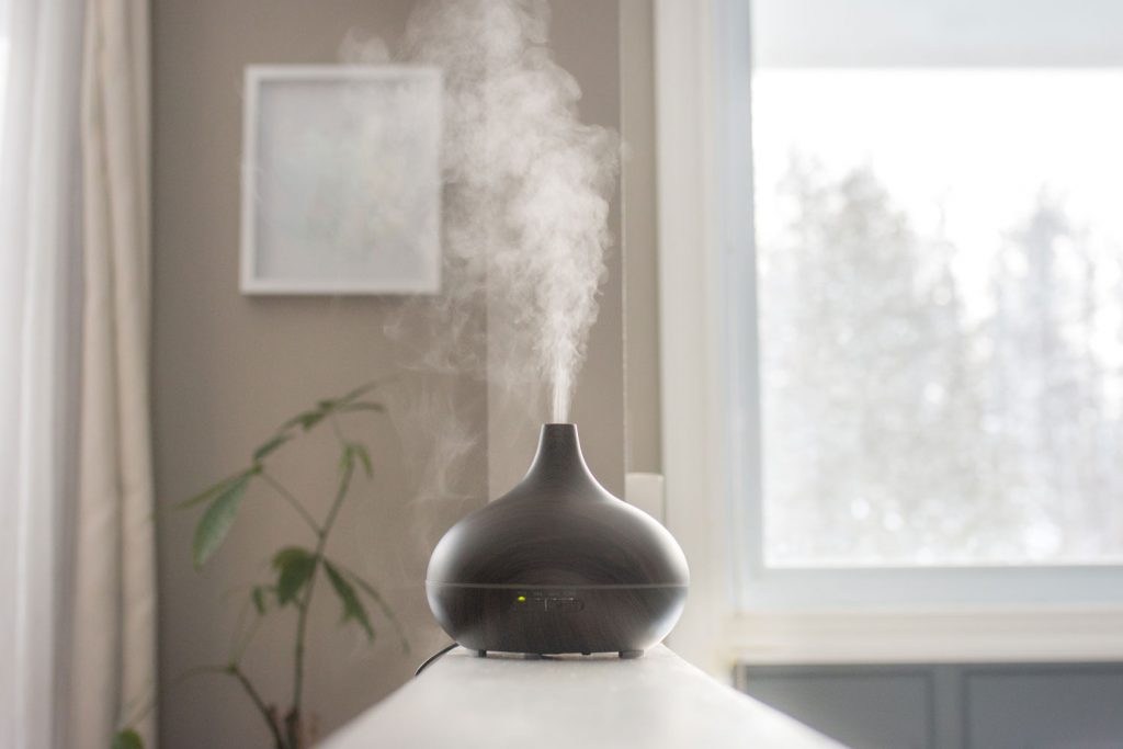 A black humidifier placed in the modern living room