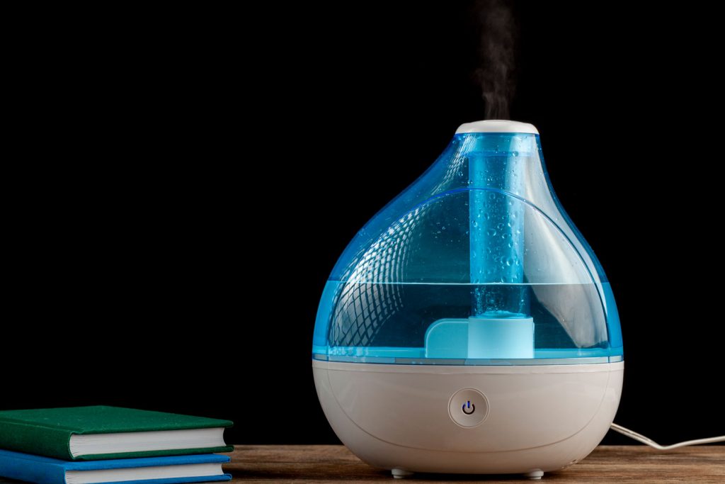 A blue covered humidifier placed on the table
