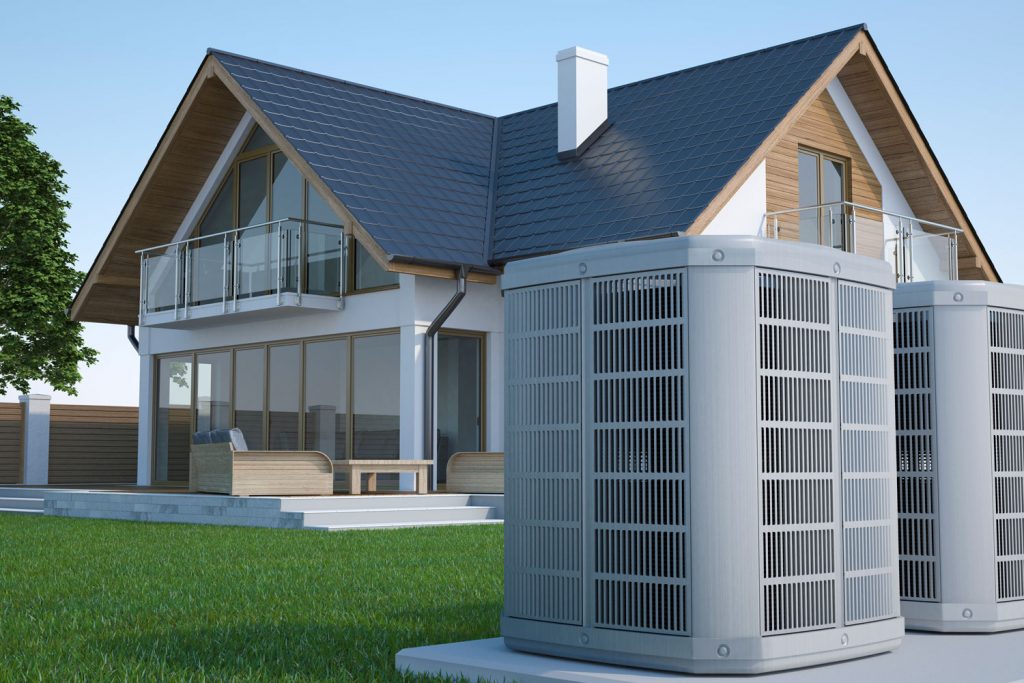 A huge house with two air heat pump placed on the front lawn