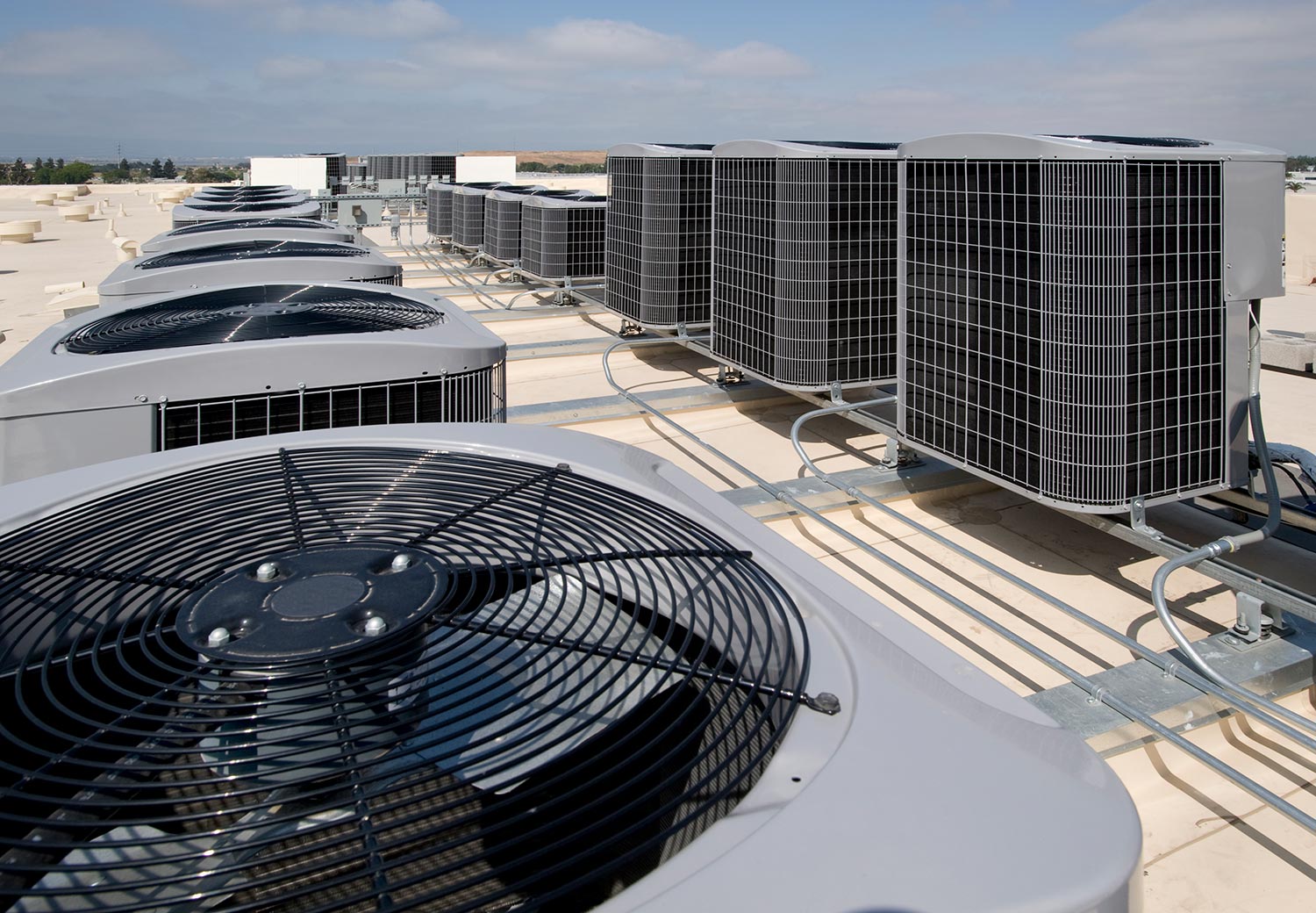 Air conditioning condensers on the roof of a large building
