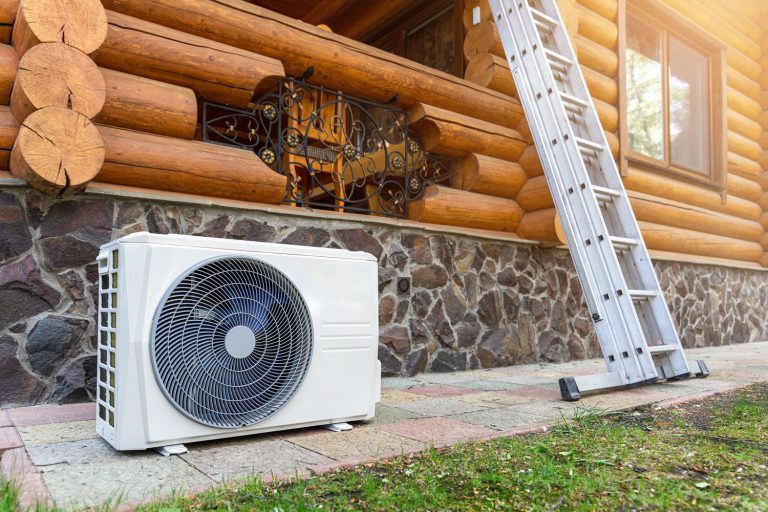 An air heat pump placed beside the log cabin, Do Heat Pumps Run On Electricity Or Gas