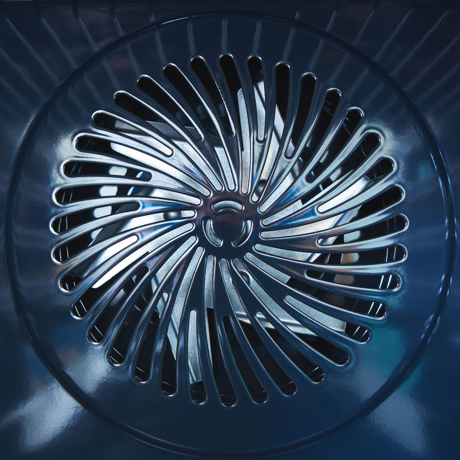Close-up of metal fan. Inside the furnace