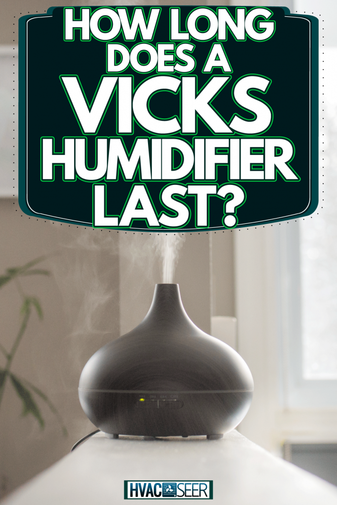 A black humidifier placed in the modern living room, How Long Does A Vicks Humidifier Last? [Longevity]